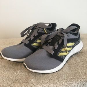 Adidas edge lux grey with gold stripes and animal print athletic shoes.